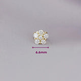 Broqueles Flor Mar de Oro Amarillo 14k, con sus medidas marcadas: 6.6 mm.